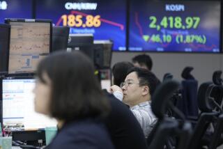 A currency trader watches monitors at the foreign exchange dealing room of the KEB Hana Bank headquarters in Seoul, South Korea, Wednesday, Oct. 4, 2023. Asian markets were sharply lower on Wednesday after Wall Street tumbled as it focused on the downside of a surprisingly strong job market: the likelihood that interest rates will stay high. (AP Photo/Ahn Young-joon)