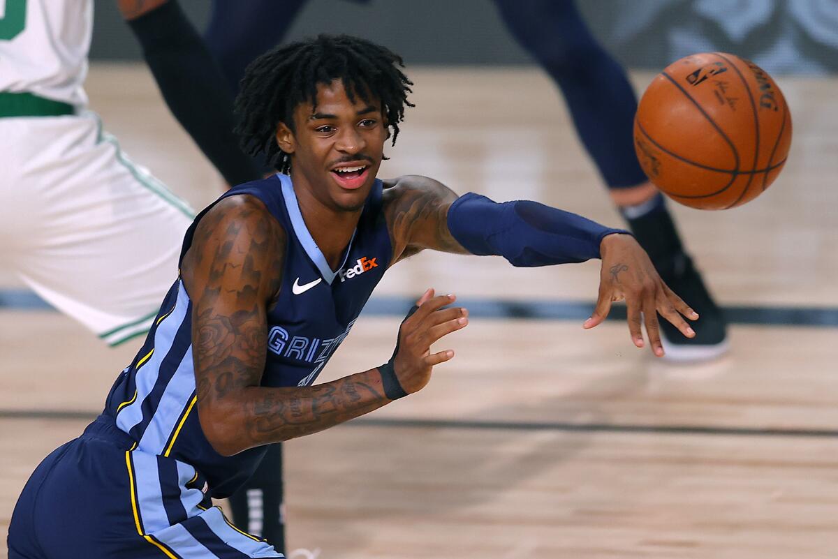 Grizzlies guard Ja Morant passes the ball during a game against the Boston Celtics on Aug. 11, 2020, in Orlando, Fla.
