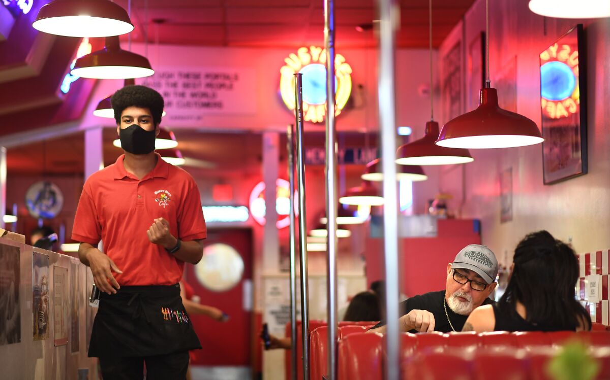 Diners enjoy a meal at BusyBee 50's Cafe in Ventura in May.