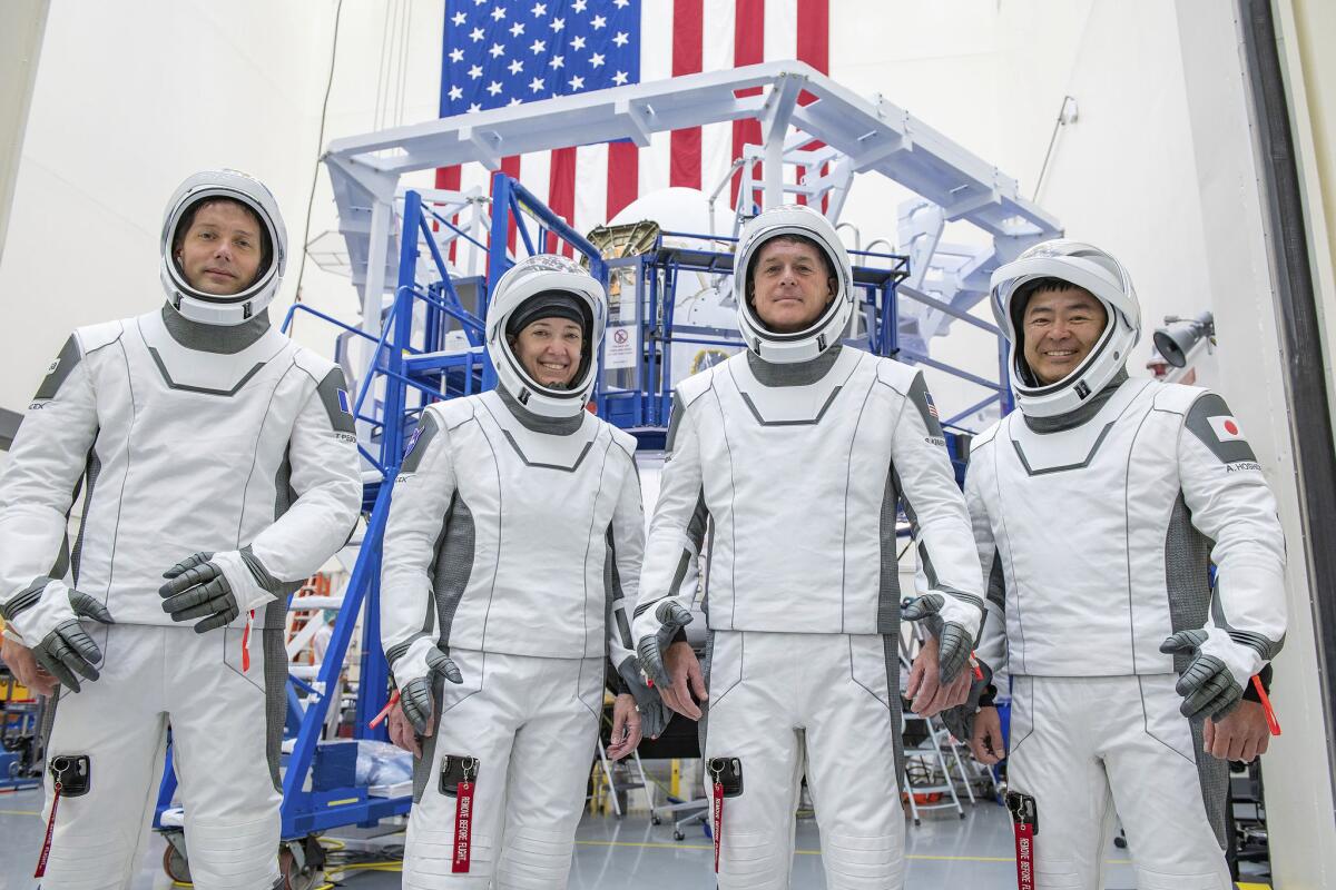 This undated photo made available by SpaceX in April 2021 shows the crew for its third astronaut launch to the International Space Station, during a training session at the SpaceX training facility in Hawthorne, Calif. From left are mission specialist Thomas Pesquet of the European Space Agency, pilot Megan McArthur and commander Shane Kimbrough of NASA, and mission specialist Akihiko Hoshide of the Japan Aerospace Exploration Agency. (SpaceX via AP)