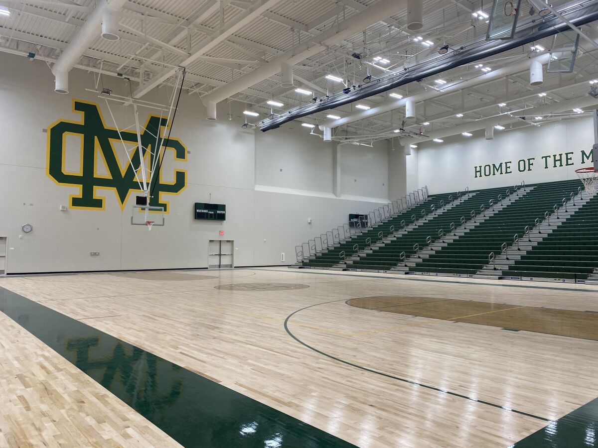 The basketball court, with the Mira Costa logo, in the new athletics complex.