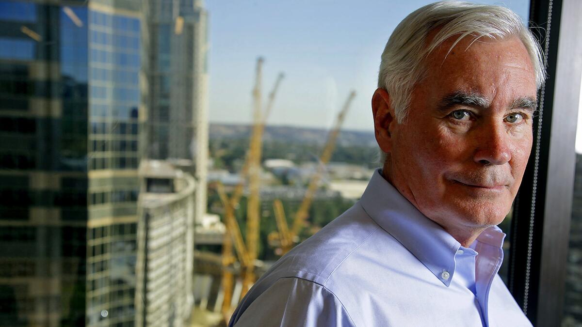 Con Howe, who served 13 years as director of the Los Angeles Planning Department, is now a managing director of housing developer Cityview. He is seen here in the company's 19th floor offices in Century City.