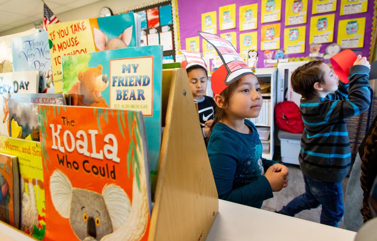 Peterson Elementary preschoolers don red and white striped headgear.