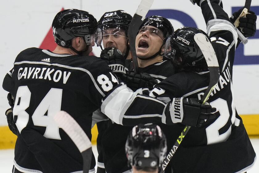 Los Angeles Kings' Trevor Moore, center right, celebrates his goal.