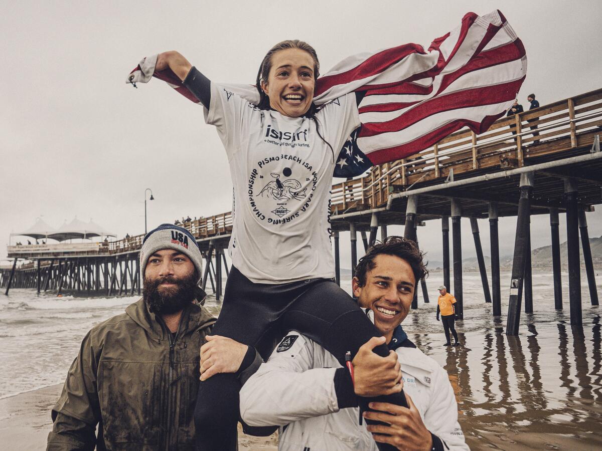 Liv Stone of the United States celebrates winning at last year's ISA World Para Surfing Championship in Pismo Beach. 