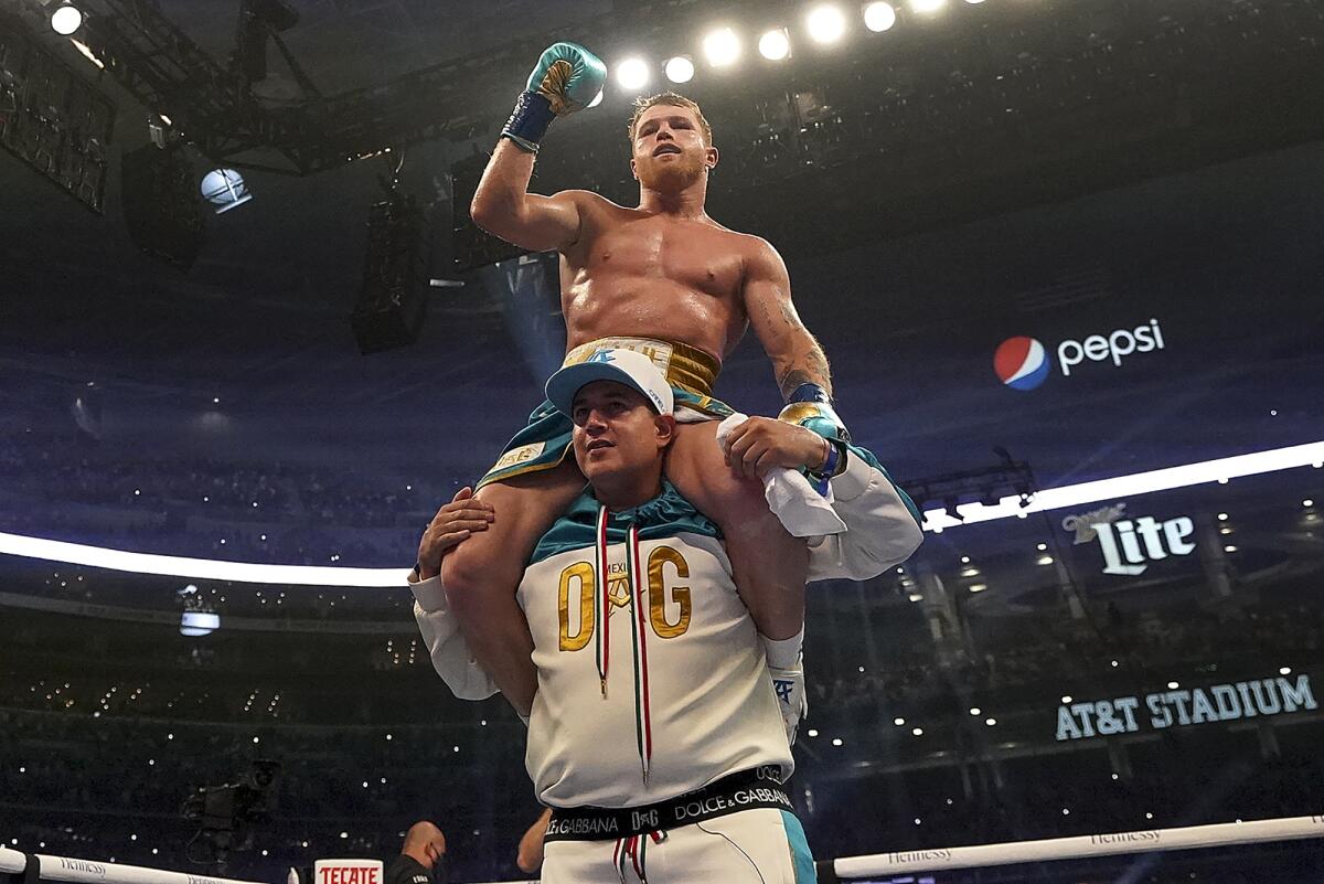 Canelo Alvarez celebrates after defeating Billy Joe Saunders.