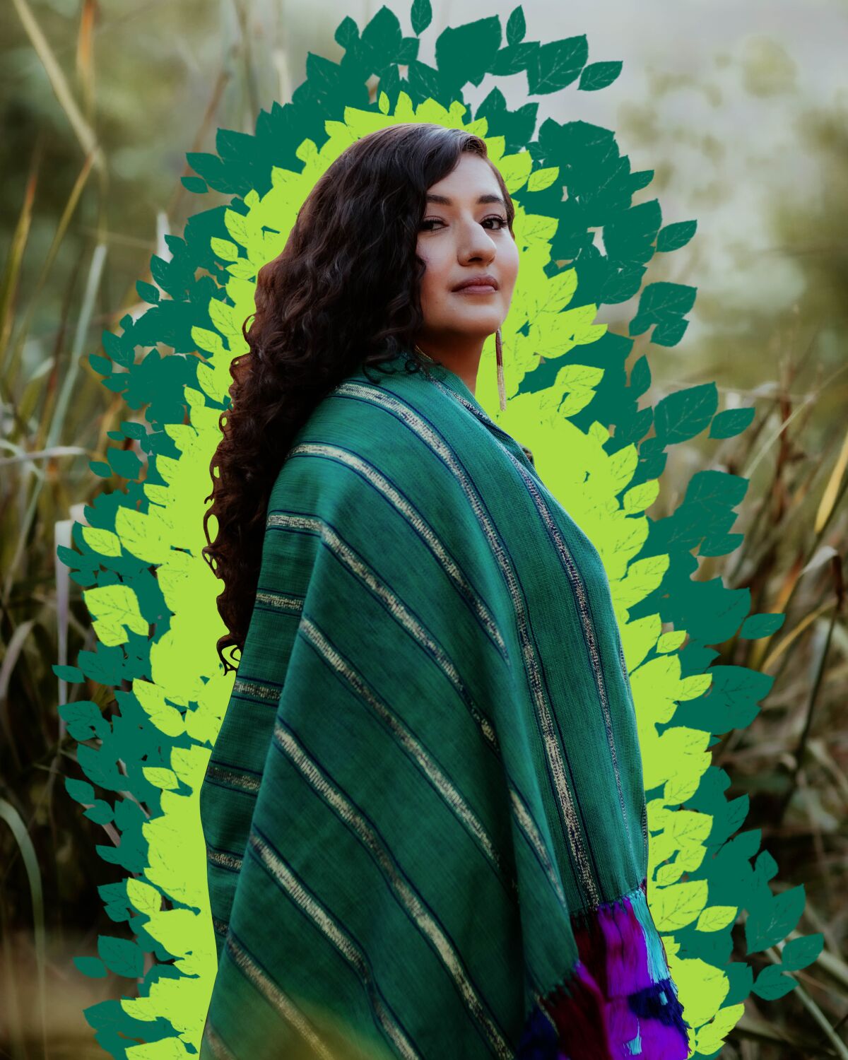 A photo illustration of a woman with long, dark hair in a cape with greenery radiating around her