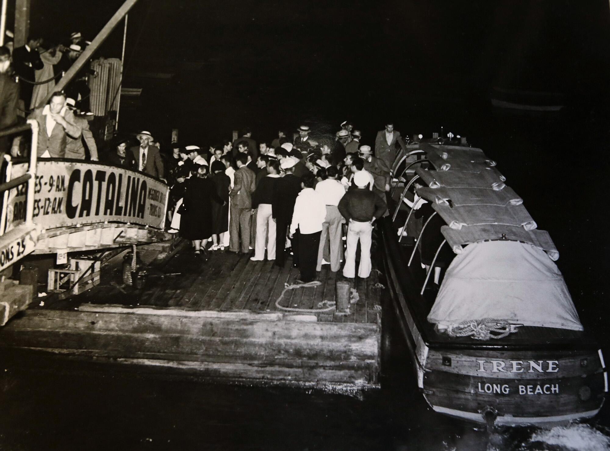 Gamblers line up to board a water taxi that would take them out to the S.S. Rex gaming vessel in the late 1930s.