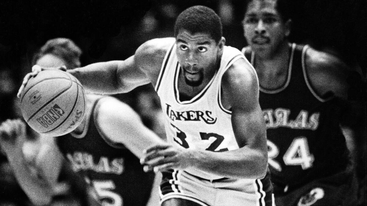 Lakers great Magic Johnson starts a fast break during a game against the Dallas Mavericks on April 3, 1985.