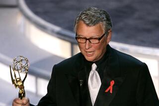 Director Mike Nichols accepts the award for outstanding directing for a miniseries, Angels In America