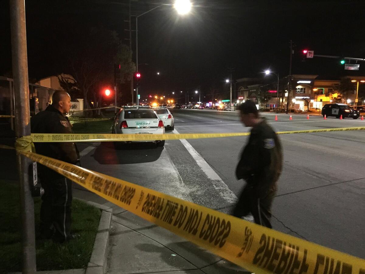 Crime scene tape blocks off the area during the search for a suspect in the fatal shooting of a San Jose police officer.