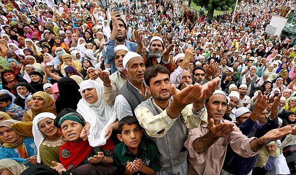Kashmiri Muslims pray during an observance of the martyrdom of Hazrat Ali, cousin of the Prophet Mohammed, on the 21st day of Ramadan at the Hazratbal Shrine in Srinagar, the summer capital of Indian Kashmir.