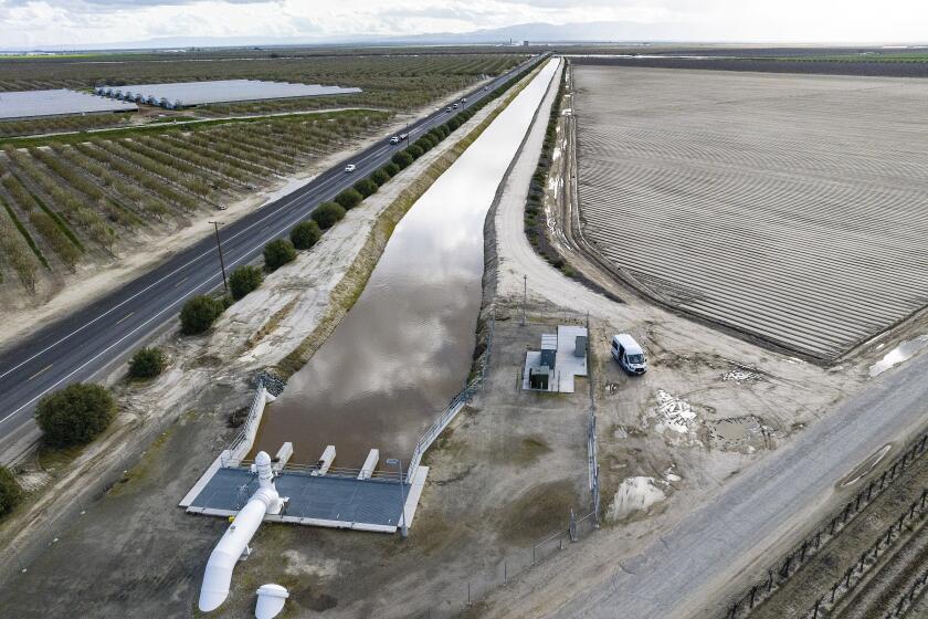 FILE - In this aerial drone photo provided by the California Department of Water Resources, the primary pump in the foreground is part of a groundwater recharge project designed to capture excess flow for groundwater storage in Fresno County on March 13, 2023. After massive downpours flooded California’s rivers and packed mountains with snow, the state reported Monday, May 6, 2024, the first increase in groundwater supplies in four years. (Andrew Innerarity/California Department of Water Resources via AP, File)
