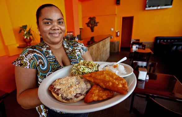 Tifara Smith serves a Sampler Platter, which includes garnaches, panades and salbutes, all common fare in Belize.