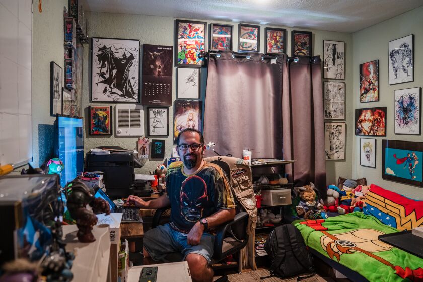 Erik Arreaga, a comic-book illustrator and a moderator of the largest San Diego Comic-Con Facebook Group sits in his home studio in Chula Vista on July 13, 2022.