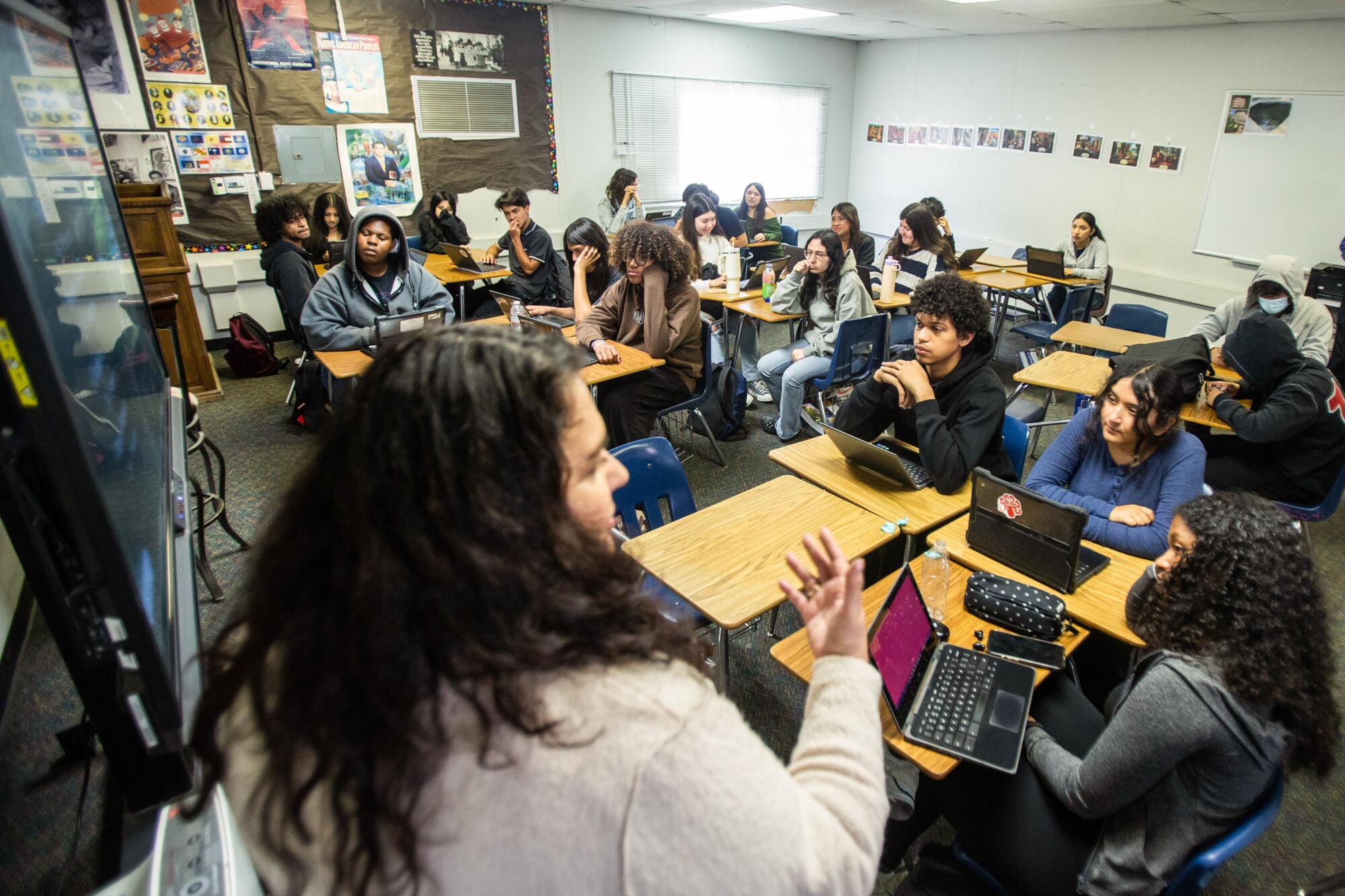Students listen as teacher Amber Palma leads a discussion during an ethnic studies class at Firebaugh High School in Lynwood.