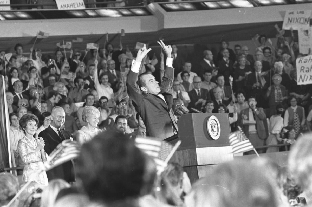 President Nixon raised his arms as he addressed a rally at the Anaheim Convention Center