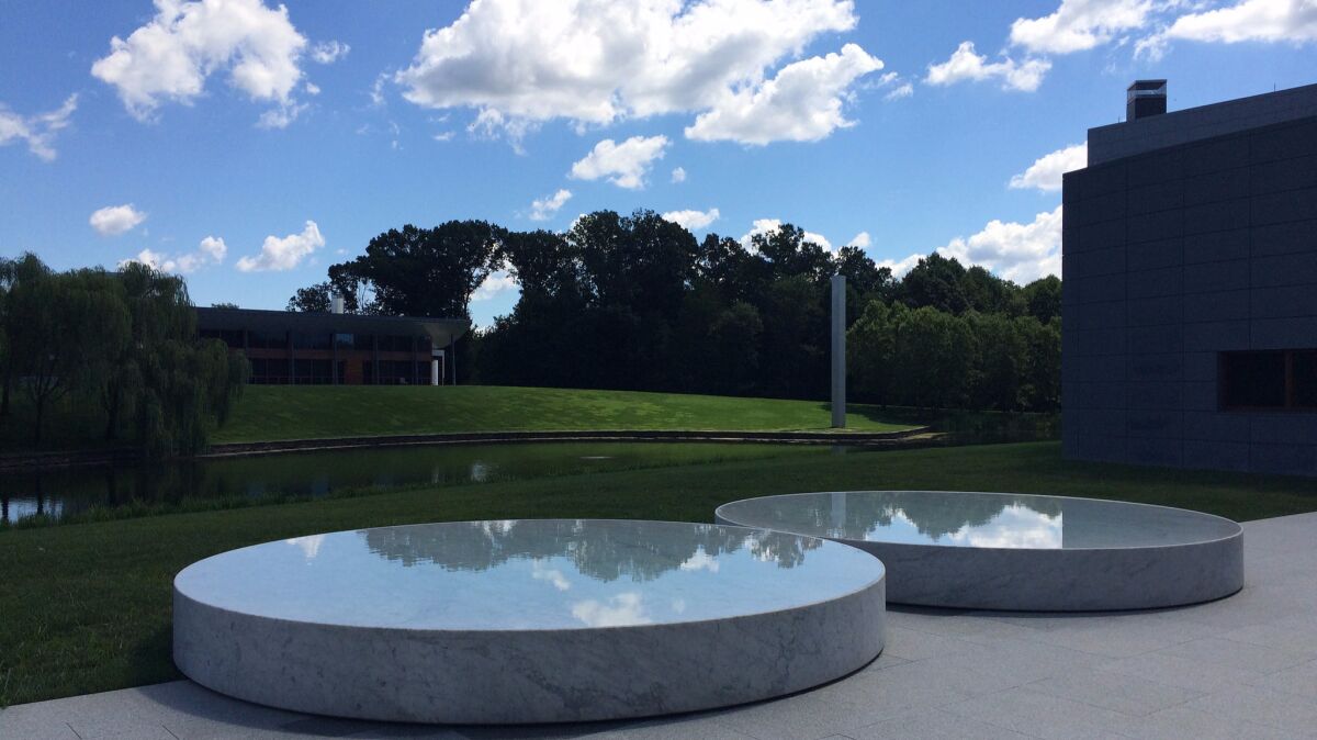 A pair of reflecting pools by Felix Gonzalez-Torres at Glenstone. Ellsworth Kelly's untitled tower can be seen in the distance.