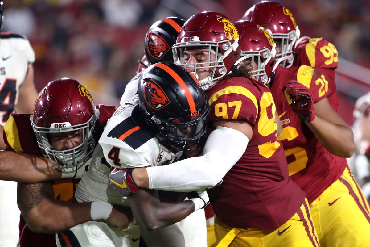 USC defensive lineman Jacob Lichtenstein tackles Oregon State running back during the Trojans' loss on Sept. 25.