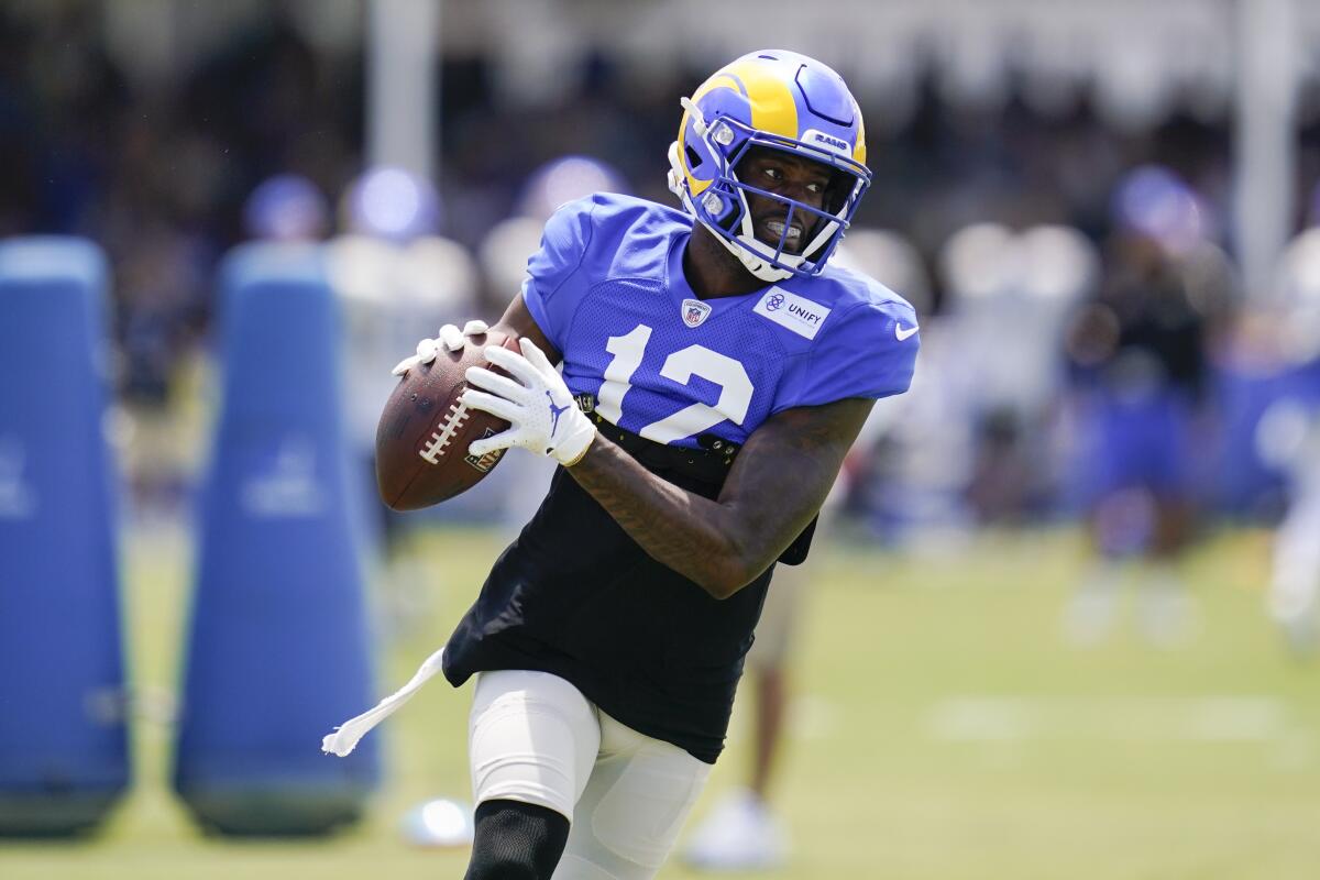 Rams wide receiver Van Jefferson catches a pass during drills.