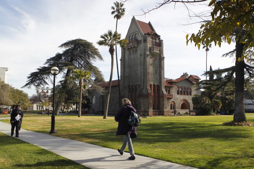 People walk past Tower Hall on the San Jose State University campus after the school announced a partnership with Udacity in San Jose, Calif. on Tuesday, Jan. 15, 2013, to offer online courses. The pilot program will begin this semester with two math classes and one statistics course. (Photo By Paul Chinn/The San Francisco Chronicle via Getty Images)