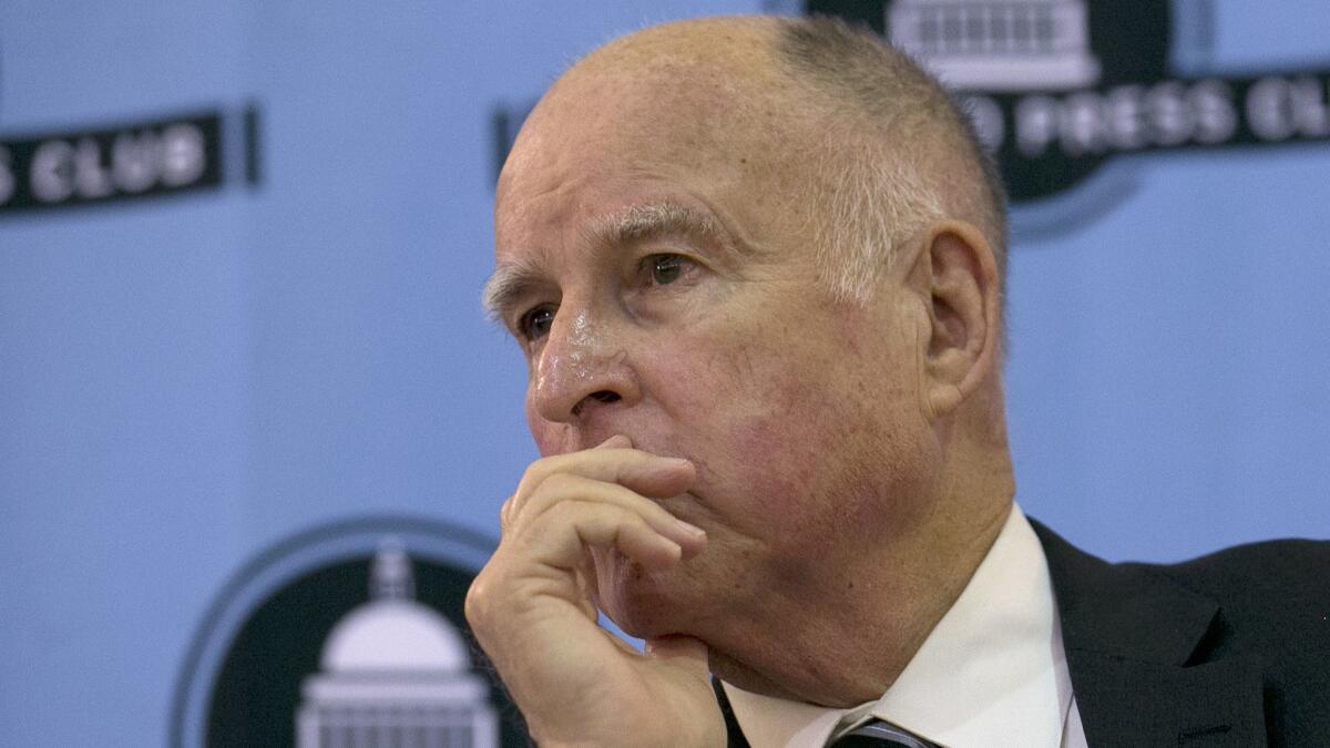 Gov. Jerry Brown listens to a question during an appearance at the Sacramento Press Club on Tuesday. Brown, a Democrat, will leave office Jan. 7 after serving a record four terms.