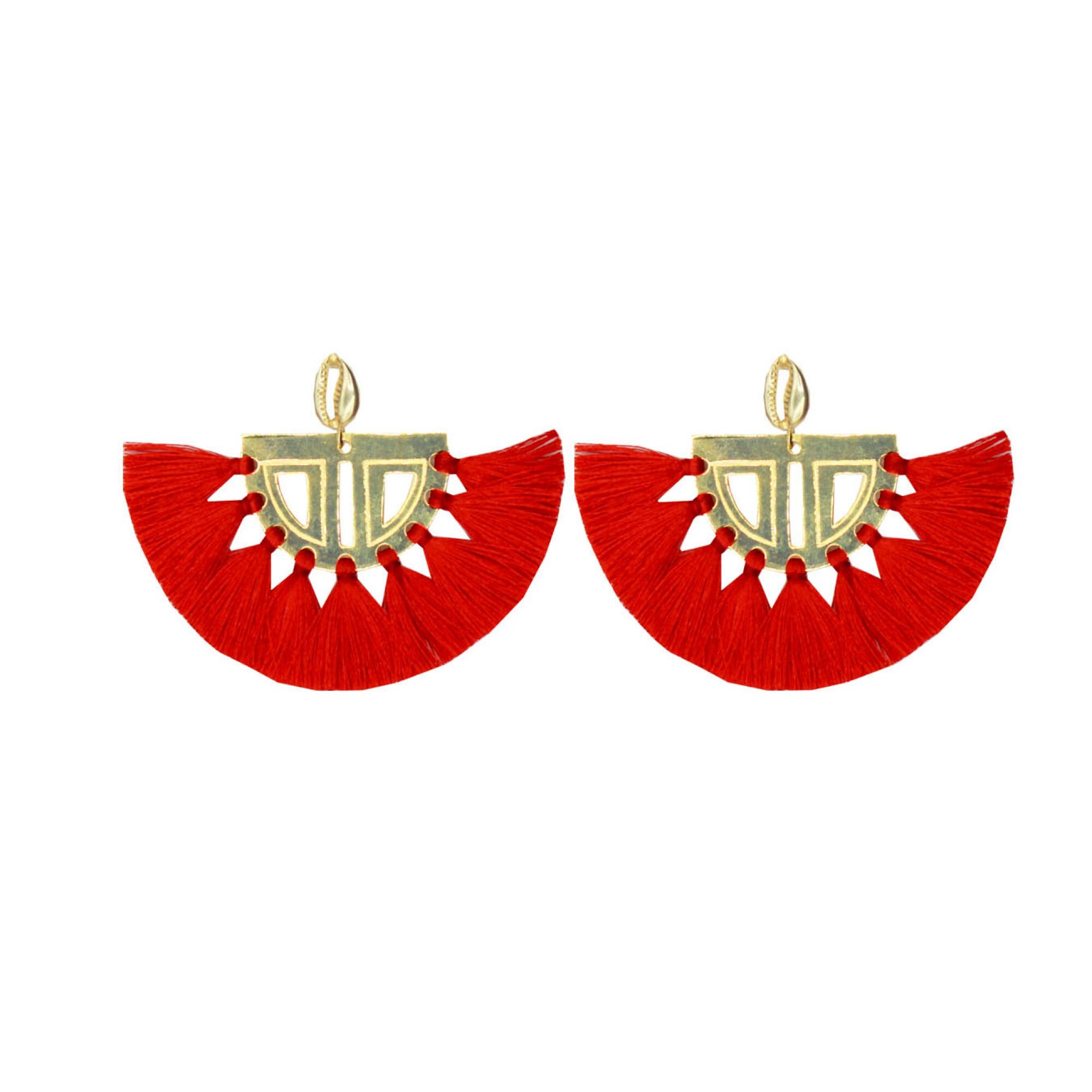 Two golden earrings in semicircular geometric forms feature a fringe made with red thread.