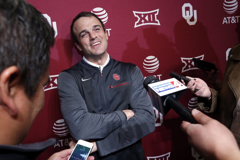 FILE - In this Jan. 26, 2018, file photo, Shane Beamer, an assistant football coach at Oklahoma, speaks during a news conference in Norman, Okla. Beamer is returning to South Carolina, this time as head coach. A source close to the search told The Associated Press on Saturday night, Dec. 5, that Beamer will be hired and take over the program run the past five seasons by Will Muschamp. Muschamp was let go last month with three games remaining in the season. The person spoke to the AP on the condition of anonymity because South Carolina has not yet made the hire official. (Steve Sisney/The Oklahoman via AP, File)
