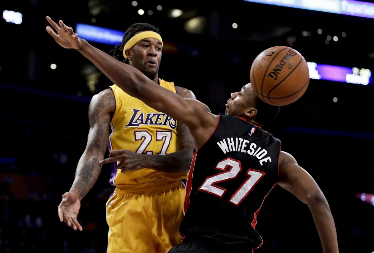 Lakers center Jordan Hill and Heat center Hassan Whiteside were involved in a late foul call in Wednesday's Heat win.