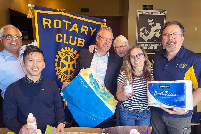 Rotarians Sumedh Bahl, Pinto Ng Zhao, Aaron Muther, Karen Herreros, Teha Eliassen and Dave Parker with some of the supplies.