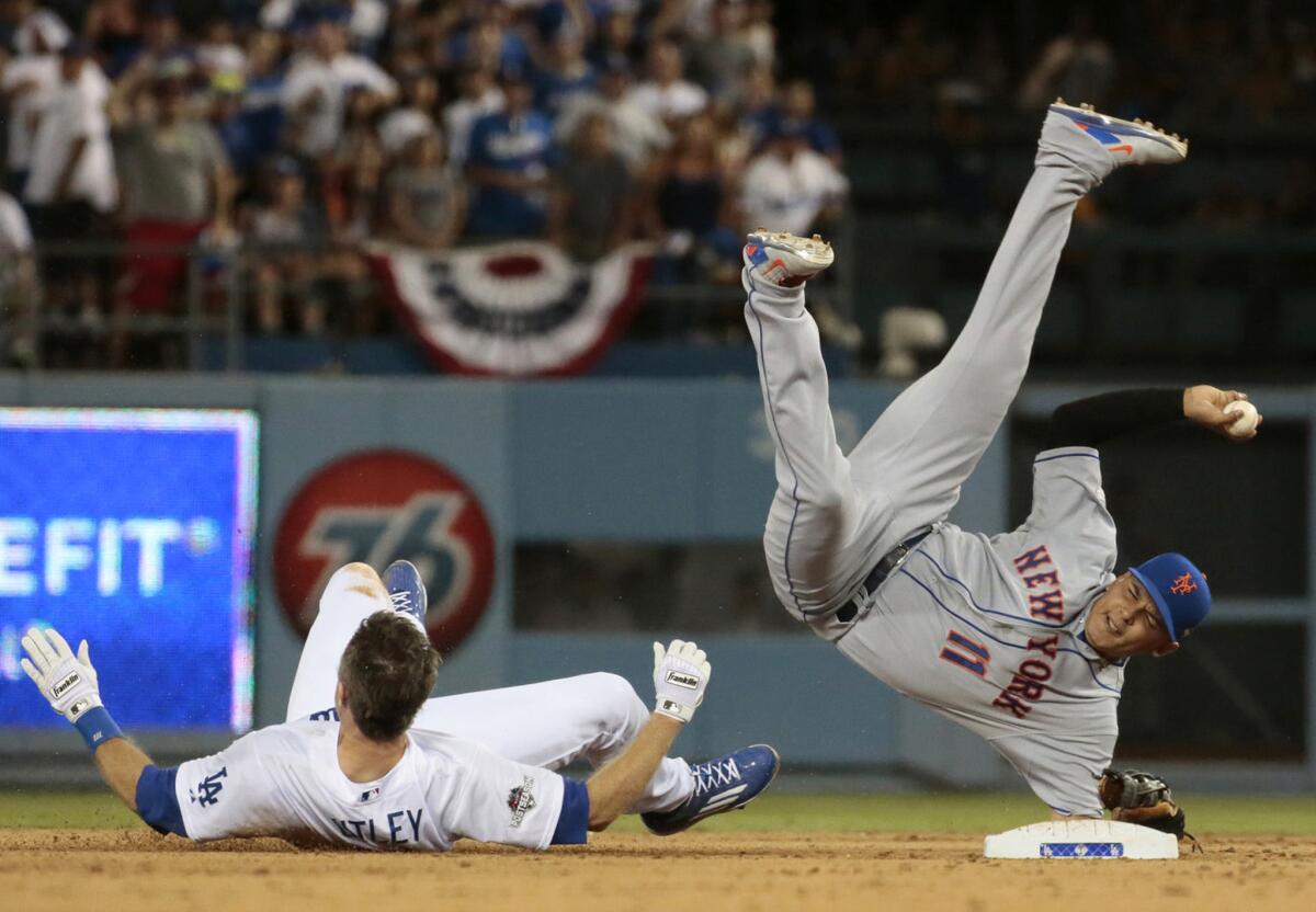 Chase Utley upends Ruben Tejada to break up a seventh inning double play during Game 2 of the National League Division Series on Oct. 10 at Dodger Stadium.
