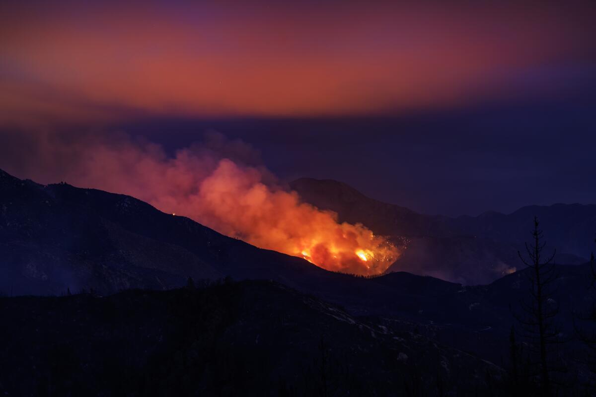  The Line fire burns in the distance at night.