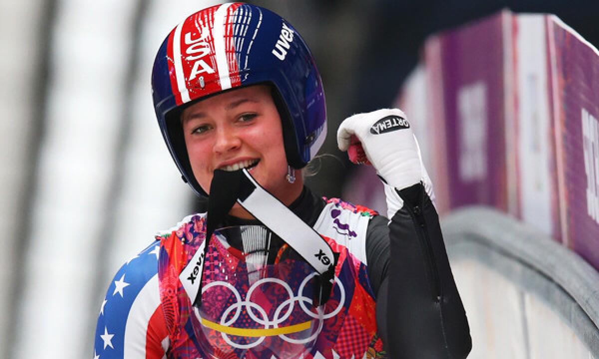 American Kate Hansen celebrates following her third luge run at the Sochi Winter Olympic Games on Tuesday. Hansen finished 10th, but the result didn't curb her enthusiasm for competing on the world's biggest stage.