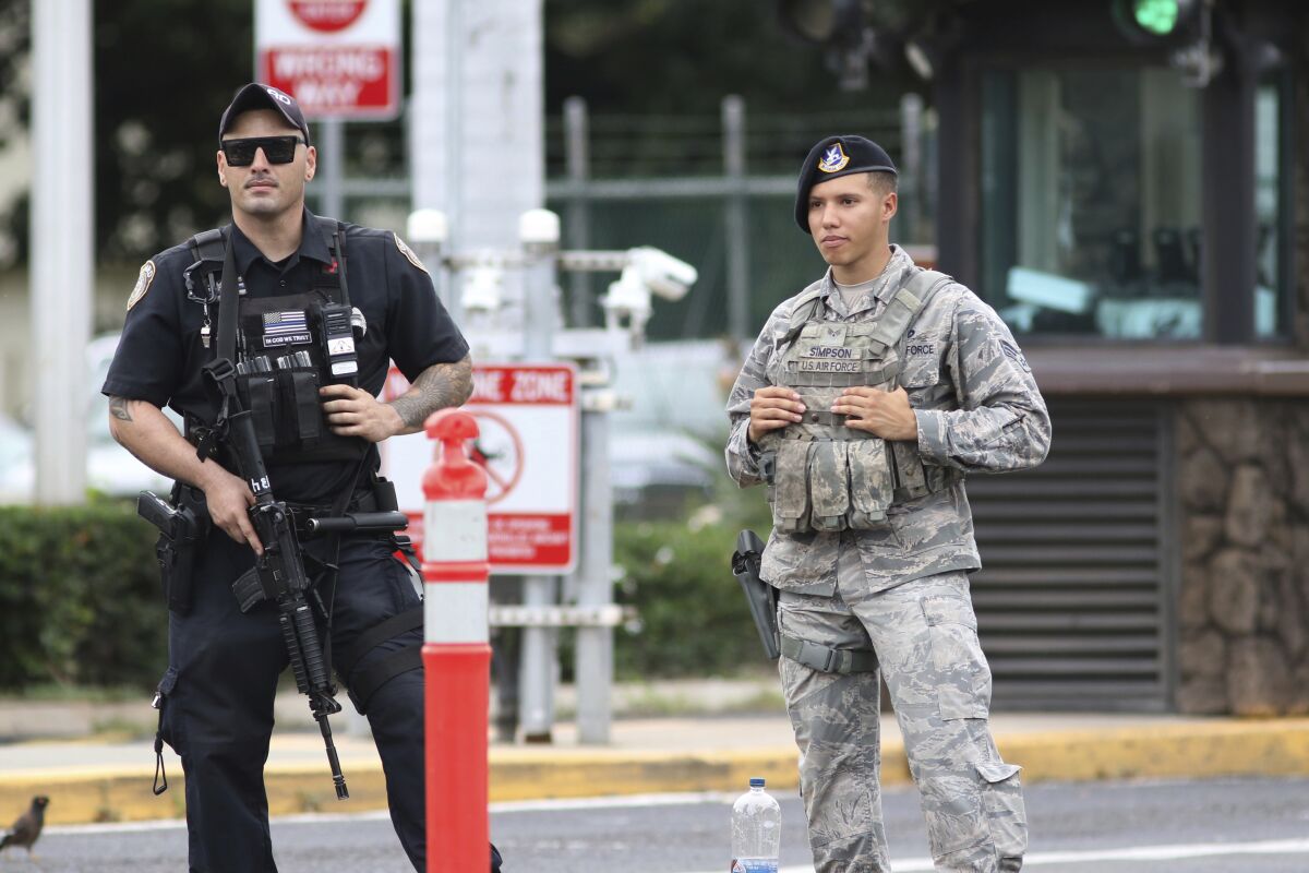 Security stands guard outside the main gate at Joint Base Pearl Harbor-Hickam, in Hawaii