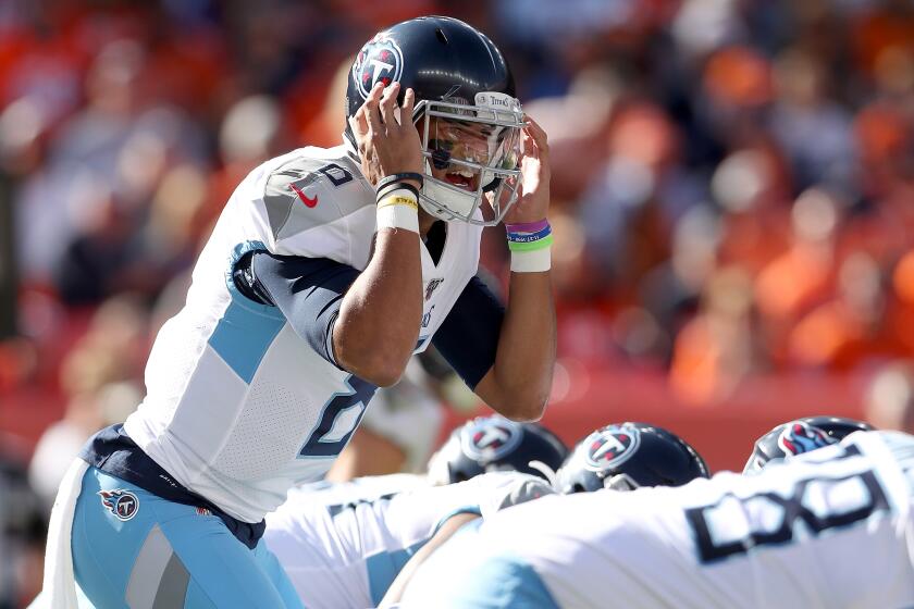 DENVER, COLORADO - OCTOBER 13: Quarterback Marcus Mariota #8 of the Tennessee Titans calls a play at the line against the Denver Broncos in the second quarter at Broncos Stadium at Mile High on October 13, 2019 in Denver, Colorado. (Photo by Matthew Stockman/Getty Images) ** OUTS - ELSENT, FPG, CM - OUTS * NM, PH, VA if sourced by CT, LA or MoD **