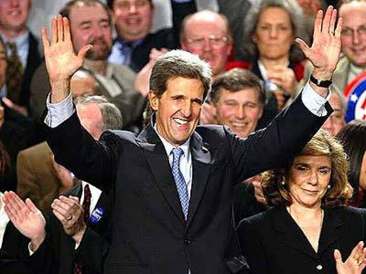 Sen. John Kerry celebrates after winning victories in five of seven states holding presidential constests on Feb. 3.