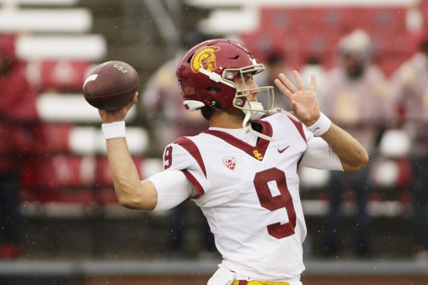 Southern California quarterback Kedon Slovis throws a pass during warm ups before an NCAA college football game against Washington State, Saturday, Sept. 18, 2021, in Pullman, Wash. (AP Photo/Young Kwak)