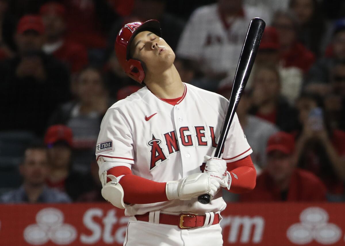 Shohei Ohtani reacts to striking out in the third inning of the Angels' 4-3 loss to the Toronto Blue Jays.