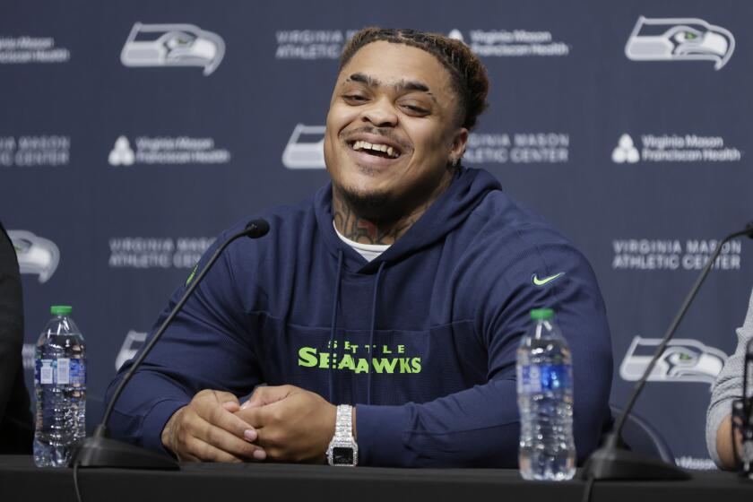 Seattle Seahawks 2024 first round draft pick, Byron Murphy II, smiles during a news conference at the NFL team's headquarters, Thursday, May 2, 2024, in Renton, Wash. (AP Photo/John Froschauer)