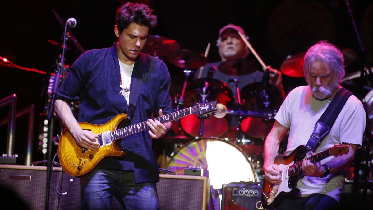 Dead & Company's John Mayer, left, Bill Kreutzmann (drums) and Bob Weir.