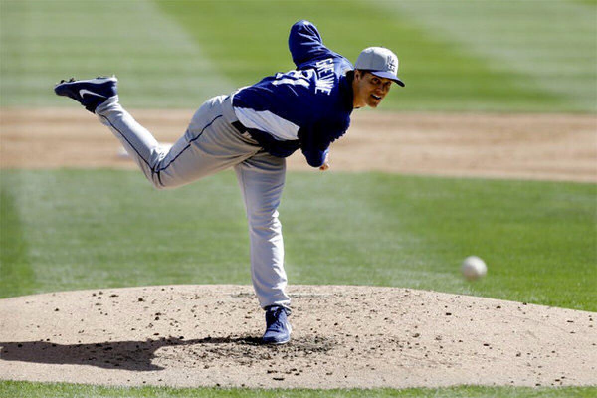 Zack Greinke throws against the Chicago White Sox in the second inning of a spring training game.