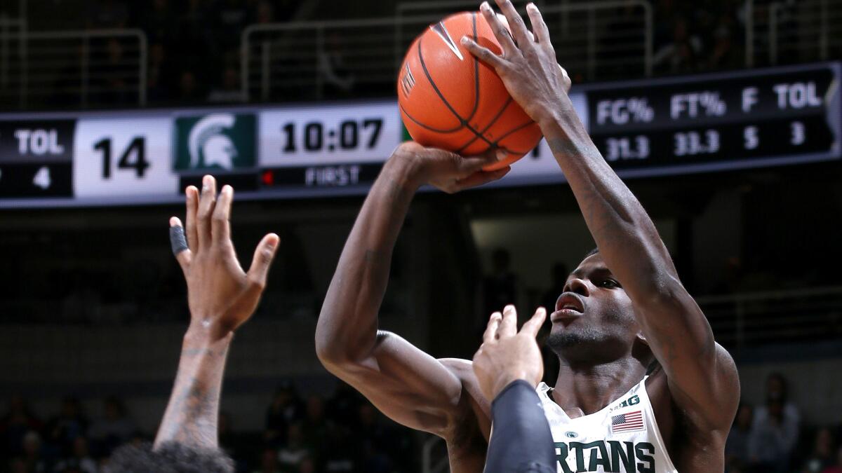 Michigan State's Eron Harris elevates for a three-point shot against Florida Gulf Coast during their game Sunday.