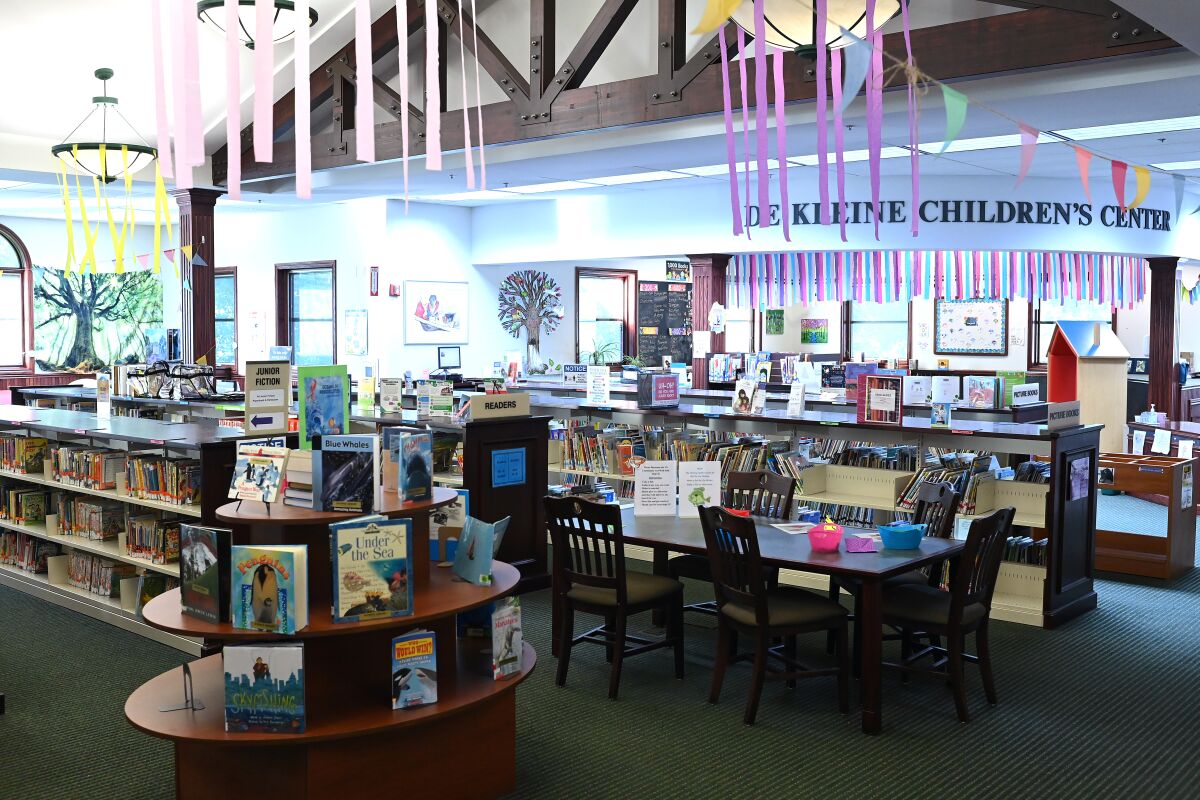 Books are displayed at the Patmos Library in Jamestown, Mich., on Aug. 11. 