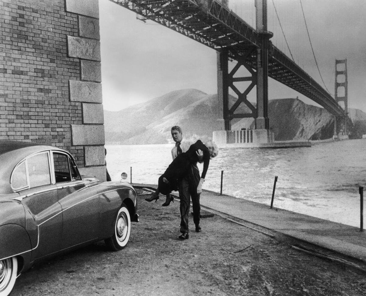  Jimmy Stewart carries an inert Kim Novak to a Rolls-Royce beneath the Golden Gate Bridge in "Vertigo."