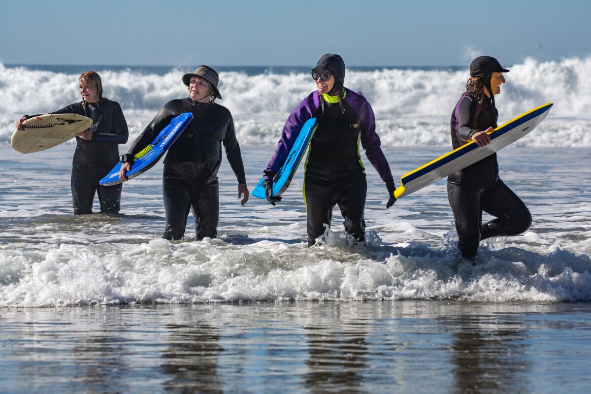 Members of the Newcomers Club of San Dieguito's Boogie Board club at Fletcher Cove in Solana Beach on Monday.