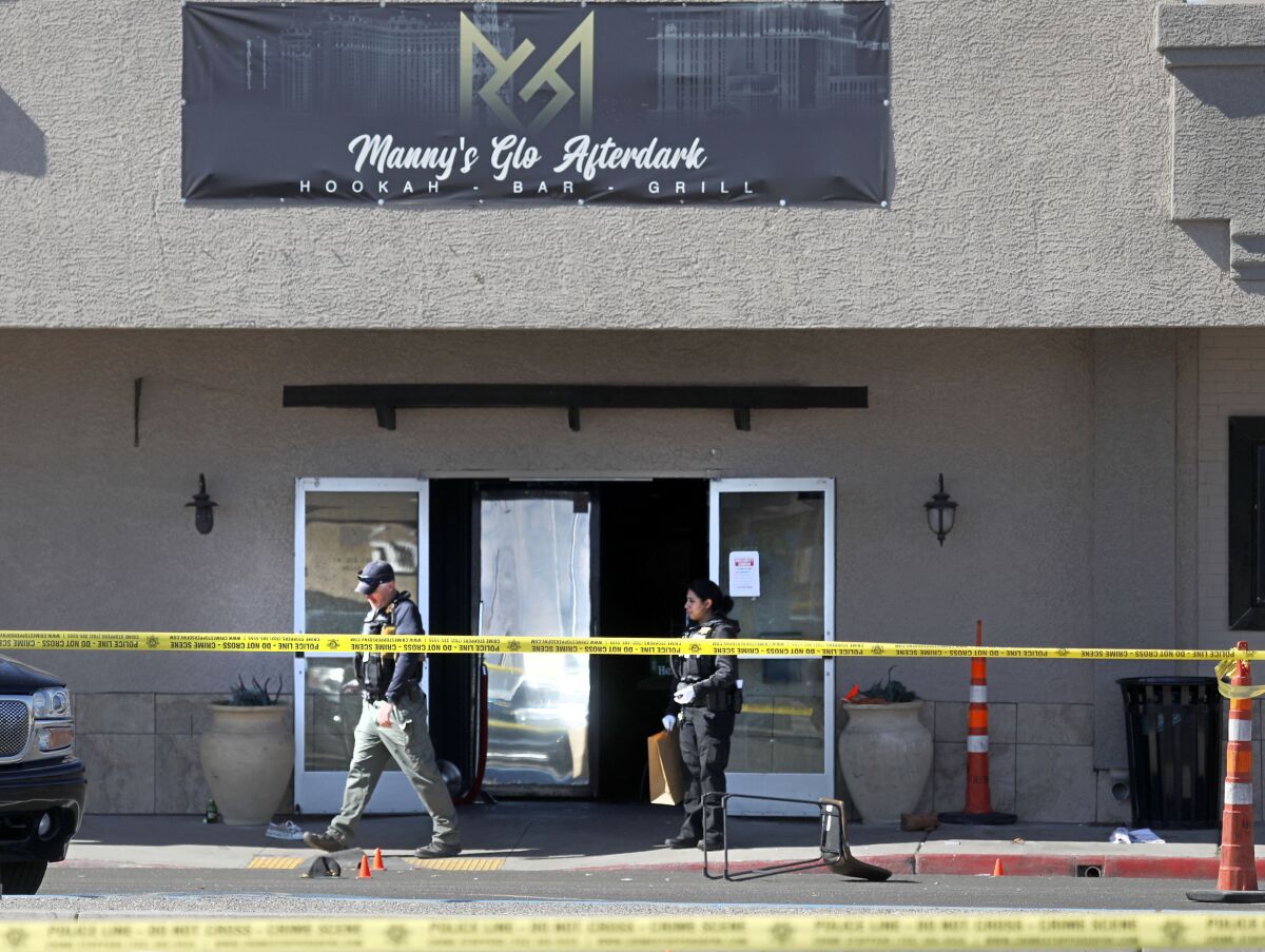FILE - Las Vegas police investigate at Manny's Glow Ultra Lounge & Restaurant, after a shooting on Feb. 26, 2022, in Las Vegas. Eleven attempted murder charges were dropped and a 44-year-old ex-convict pleaded guilty Wednesday, May 18, 2022, to a single felony charge in a deadly shootout at a Las Vegas lounge that killed a man and injured at least 12 others. (Chitose Suzuki/Las Vegas Review-Journal via AP, File)