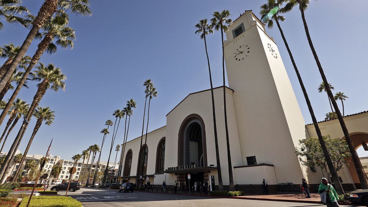 Passengers pass through the historic Union Station in Los Angeles, which is a carefree three-hour Amtrak train ride from downtown San Diego’s Santa Fe Depot.