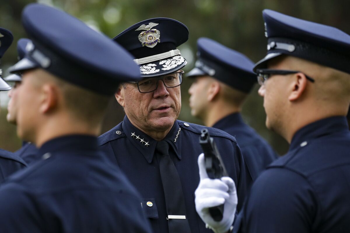 LAPD Chief Michel Moore inspects a graduating class of recruits in 2022  