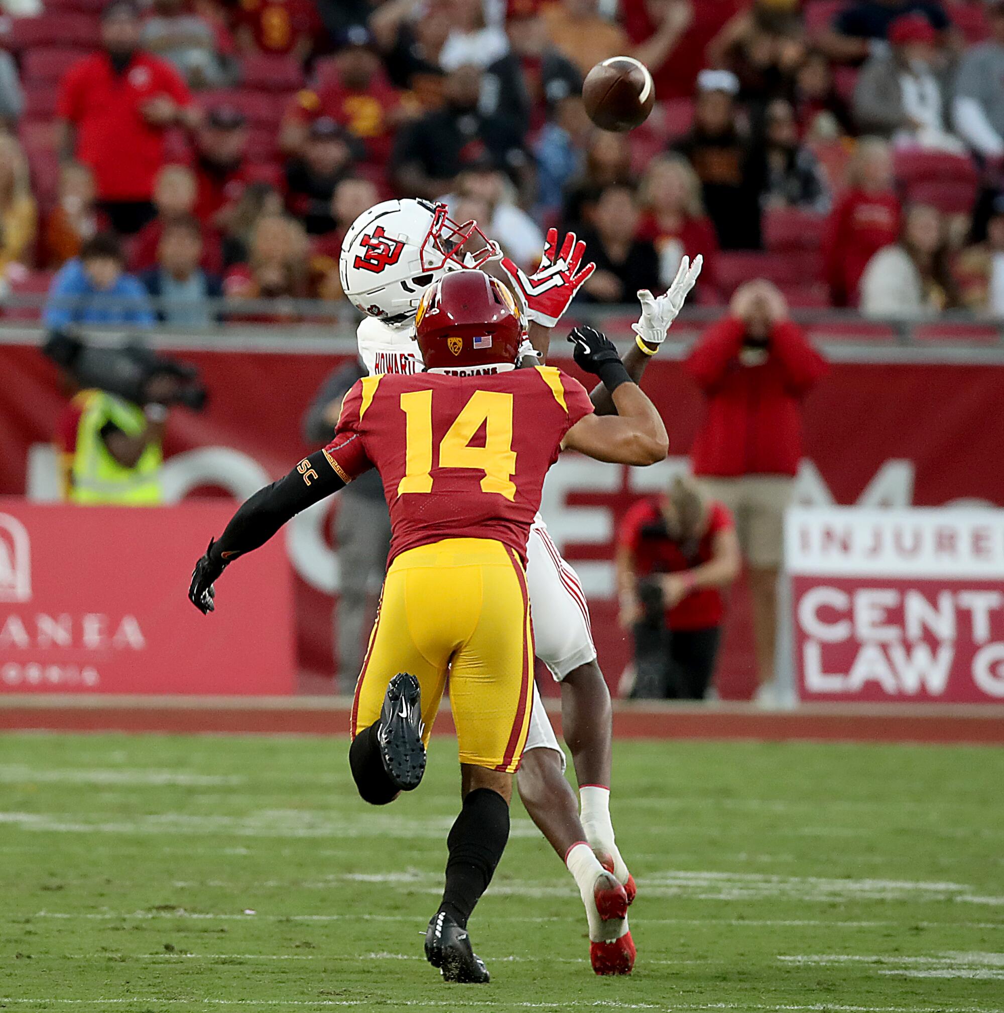 Utah receiver Theo Howard makes a catch over USC cornerback Jayden Williams in the first half.