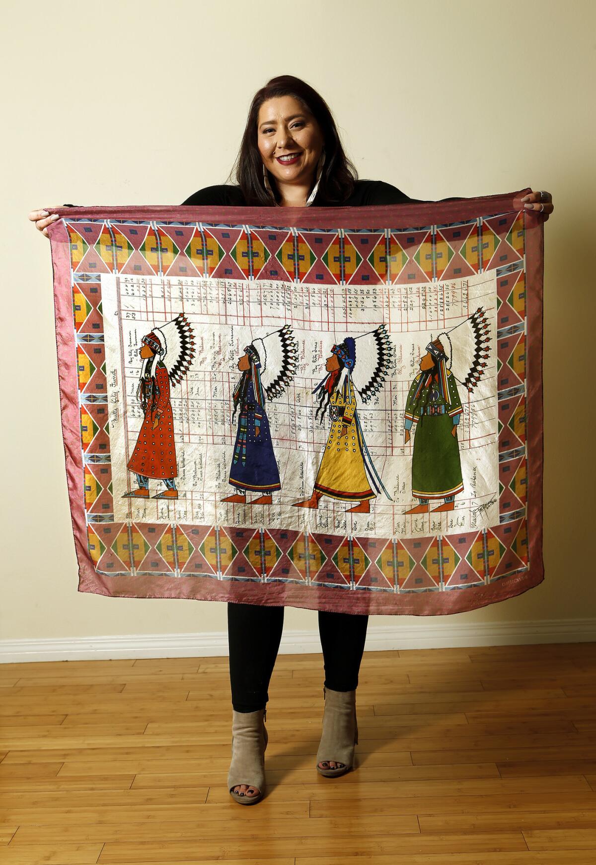 Crow and Northern Cheyenne fashion designer Bethany Yellowtail displays her 100% silk "Women Warrior" ledger scarf at her studio in Valley Village on Jan. 11, 2017.